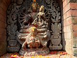 Kathmandu Changu Narayan 13 Vishnu With 12 Arms, Seven Heads Including Boar And Lion Heads Riding Garuda With Lakshmi On Lap Just to the left of the Kileshwor Temple at Changu Narayan is Vishnu with 12 arms and 7 heads, including boar and lion heads, riding on Garuda with Lakshmi (Laxmi) on his lap.
